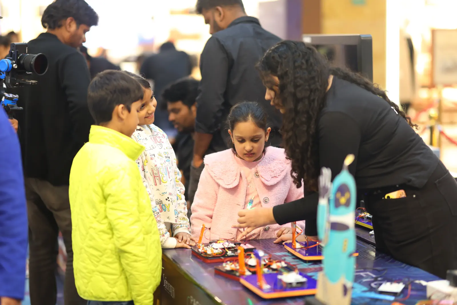 A table of laid-out science experiment materials ready for a MakerMasti session