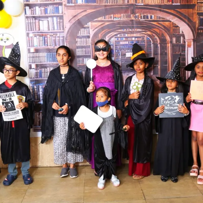Children lined up in wizard costumes at a Science of Wizards party