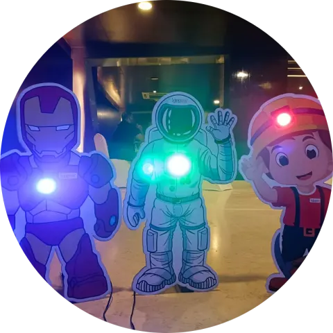 Children in superhero capes running a science experiment